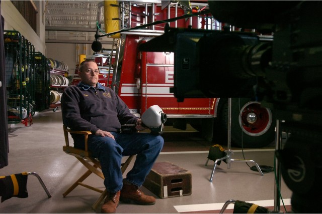 Hudson Fire Chief Tim Hutchings being interviewed by Bill Couturie' for &quot;Into the Fire&quot;. Chip Moon photo